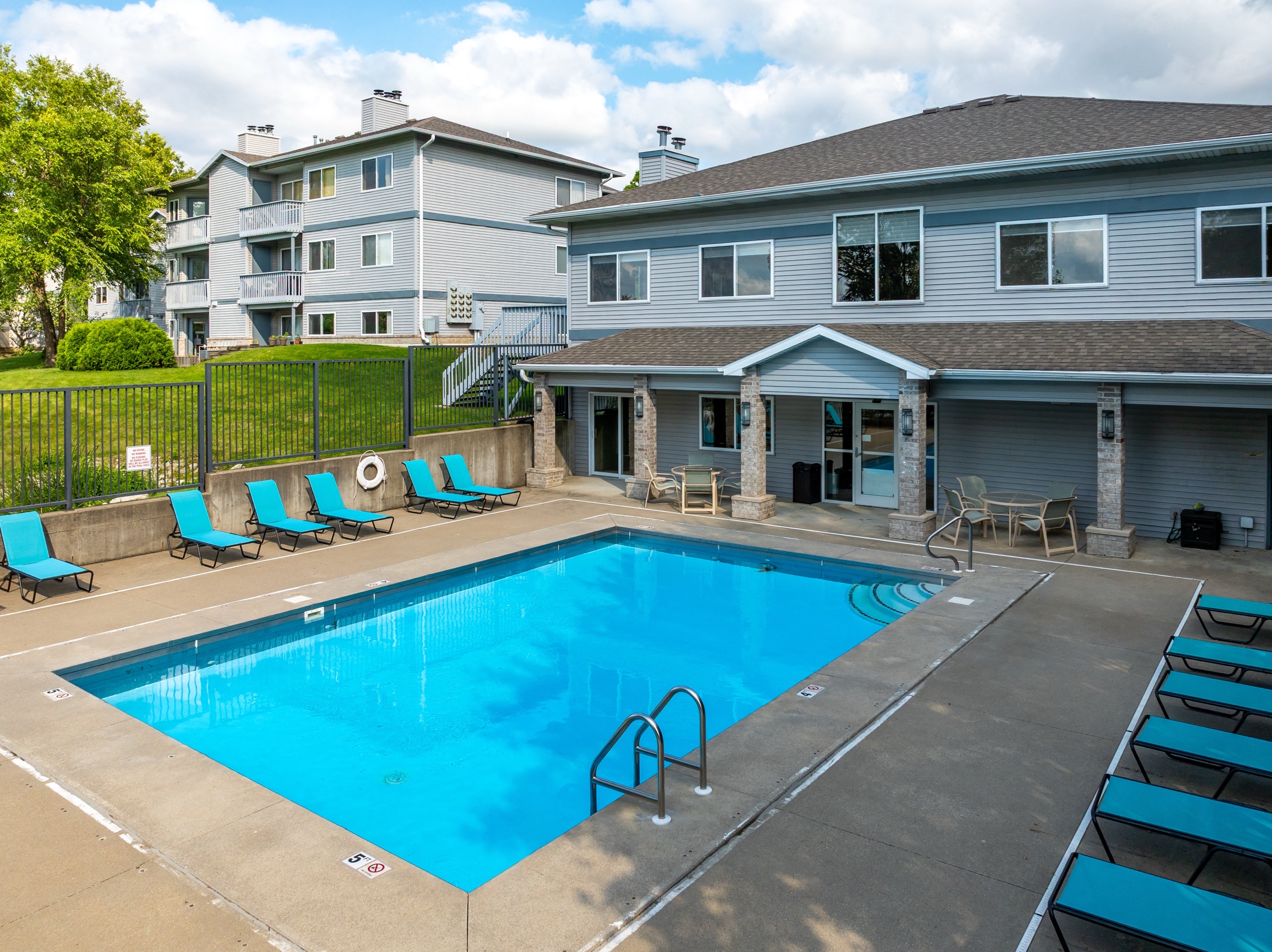 clubhouse and pool tanning deck
